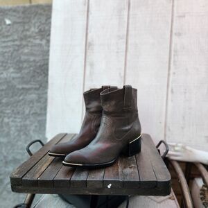 Rachel Zoe‎  Western trend, this city-slick cowgirl bootis cut from calfskin